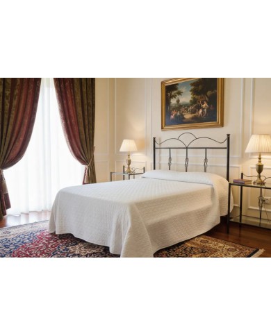 Testata letto una piazza e mezza Fiocco in ferro battuto artigianale con giroletto, finitura nero oro, per rete 120x190.