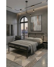 Letto in ferro nero Aura con testata a cerchi moderni e rete a doghe integrata. Design minimale e struttura robusta artigianale.